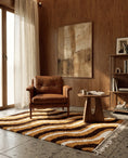 Load image into Gallery viewer, Brown, Cream and Ochre Yellow wavy wool rug in a furnished room
