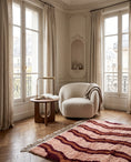 Load image into Gallery viewer, Burgundy, Terracotta and Blush Pink wavy wool rug in a furnished room
