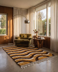 Load image into Gallery viewer, Brown, Cream and Ochre Yellow wavy wool rug in a furnished room
