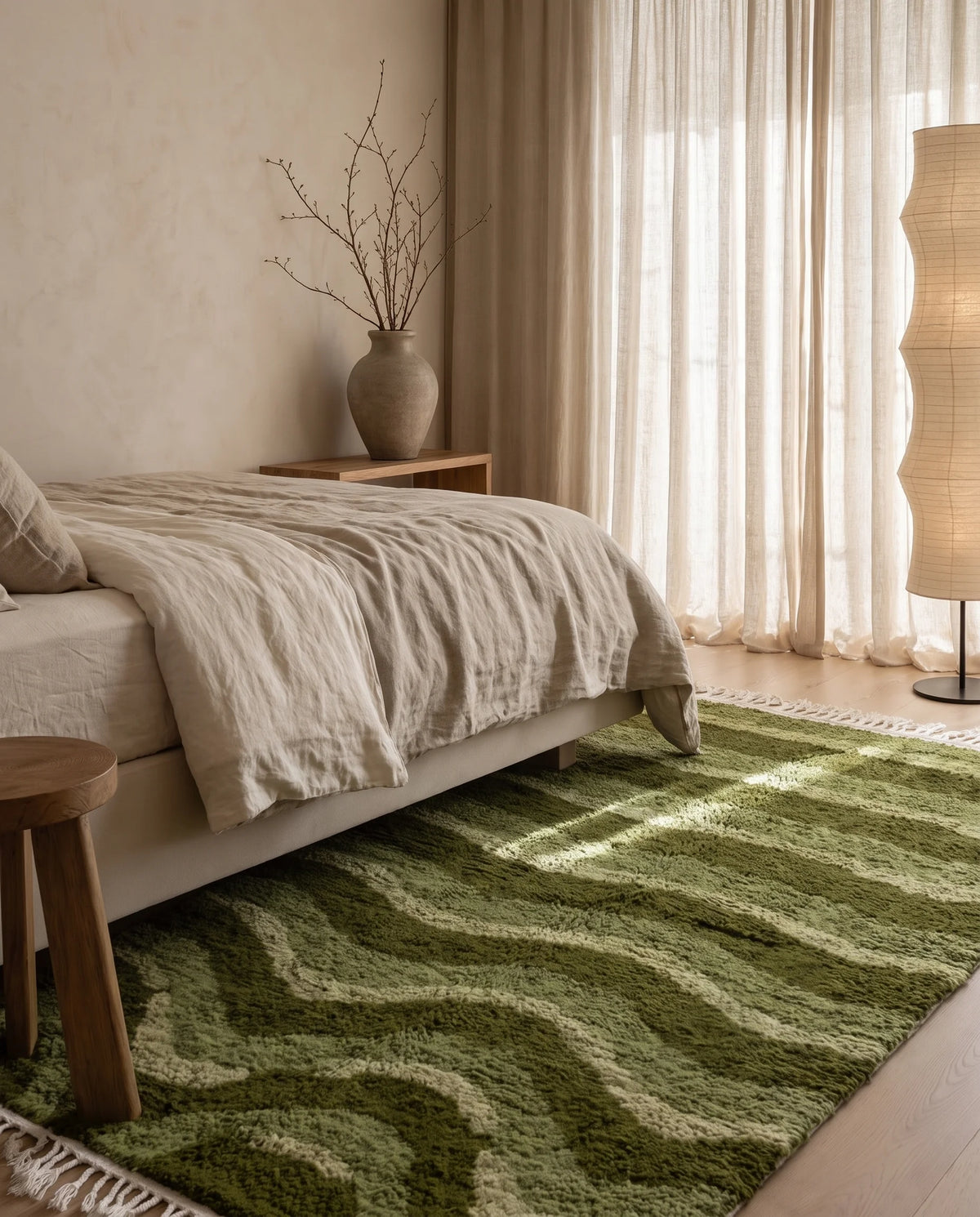 Moss, Sage and Olive Green wavy wool rug in a furnished room