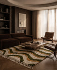 Load image into Gallery viewer, Olive Green, Ochre Yellow and Cream wavy wool rug in a furnished room
