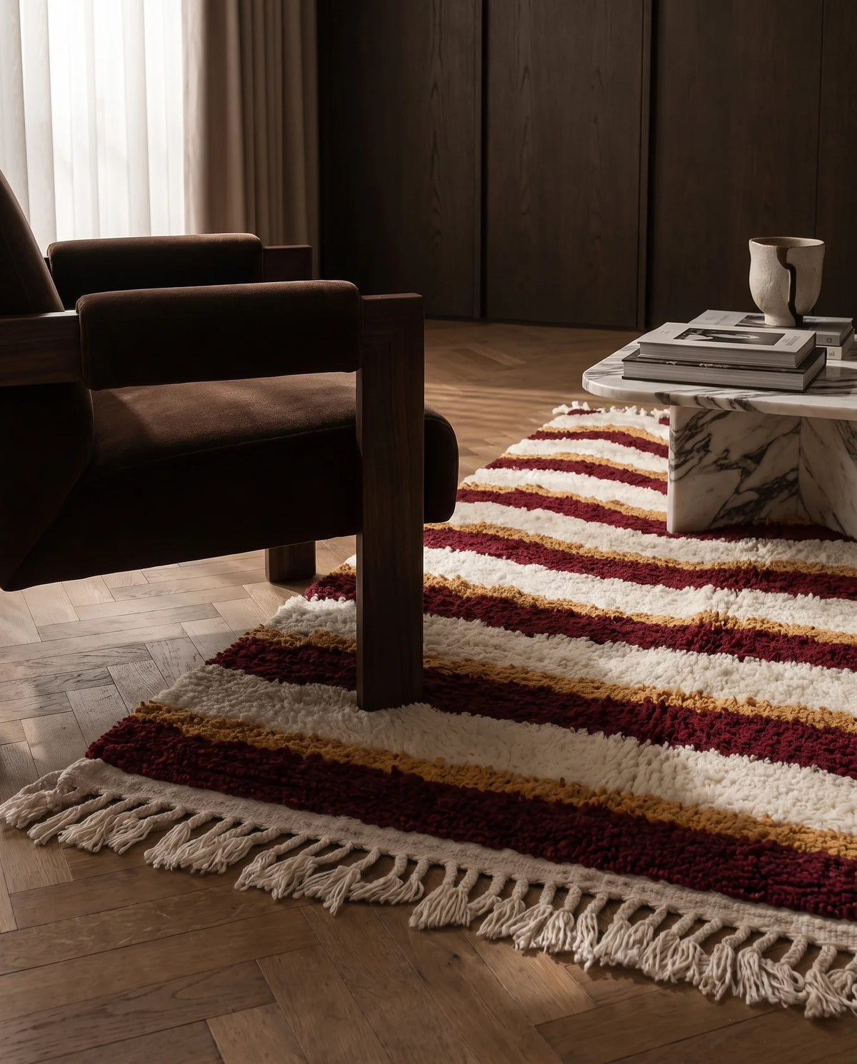 Burgundy, Ochre Yellow and Cream wavy wool rug in a furnished room
