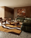 Load image into Gallery viewer, Brown, Cream and Ochre Yellow wavy wool rug in a furnished room
