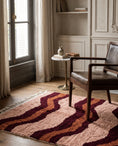 Load image into Gallery viewer, Burgundy, Terracotta and Blush Pink wavy wool rug in a furnished room
