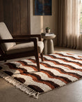 Load image into Gallery viewer, Brown, Terracotta and Cream wavy wool rug in a furnished room
