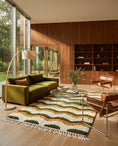Load image into Gallery viewer, Olive Green, Ochre Yellow and Cream wavy wool rug in a furnished room

