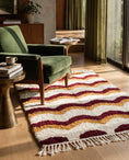 Load image into Gallery viewer, Burgundy, Ochre Yellow and Cream wavy wool rug in a furnished room
