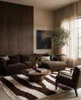 Load image into Gallery viewer, Brown and Cream zebra stripe wool rug in a furnished room
