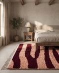 Load image into Gallery viewer, Burgundy and Blush Pink zebra stripe wool rug in a furnished room
