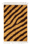 Slant Stride zebra stripe wool rug, dark brown stripes on ochre yellow, full view from above with fringed ends