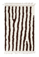Long Stride zebra stripe wool rug, dark brown stripes on cream, full view from above with fringed ends