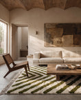 Load image into Gallery viewer, Olive Green and Cream zebra stripe wool rug in a furnished room
