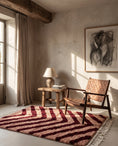 Load image into Gallery viewer, Burgundy and Blush Pink zebra stripe wool rug in a furnished room
