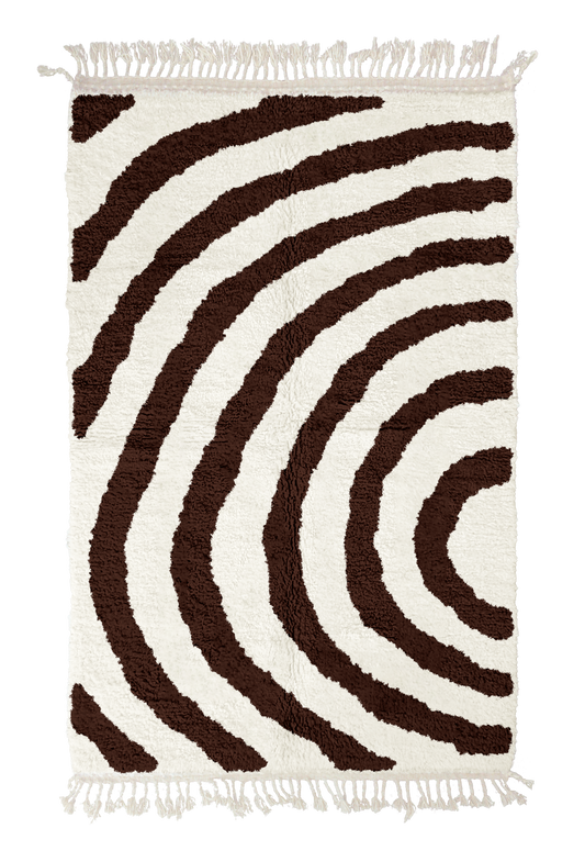 Arc Stride zebra stripe wool rug, dark brown stripes on cream, full view from above with fringed ends