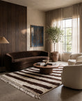 Load image into Gallery viewer, Brown and Cream zebra stripe wool rug in a furnished room
