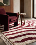 Load image into Gallery viewer, Burgundy and Cream zebra stripe wool rug in a furnished room
