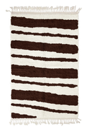 Double Stride zebra stripe wool rug, dark brown stripes on cream, full view from above with fringed ends
