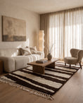 Load image into Gallery viewer, Cream and Dark Brown zebra stripe wool rug in a furnished room
