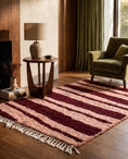 Load image into Gallery viewer, Burgundy and Blush Pink zebra stripe wool rug in a furnished room
