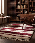 Load image into Gallery viewer, Burgundy and Cream zebra stripe wool rug in a furnished room
