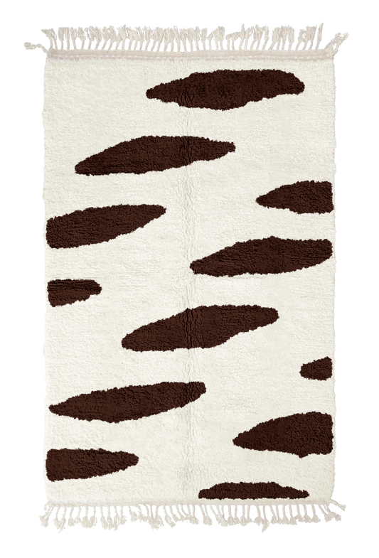 Brush Stride zebra stripe wool rug, dark brown stripes on cream, full view from above with fringed ends