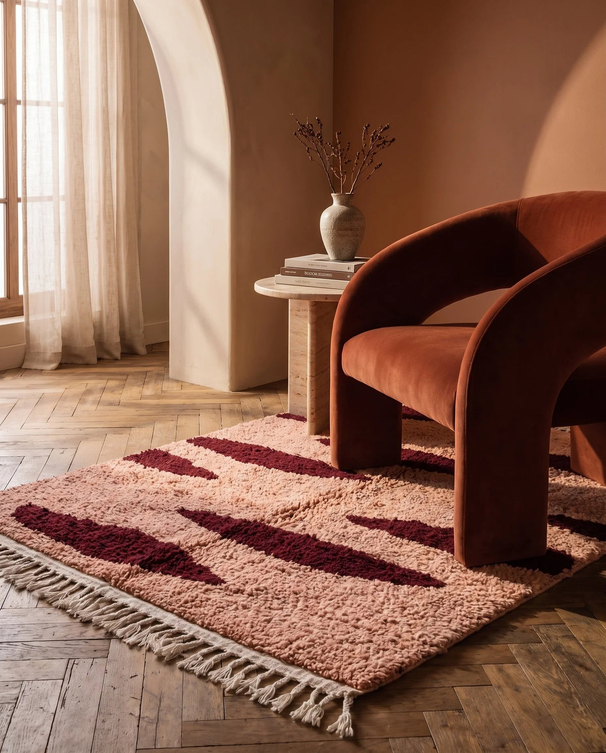 Burgundy and Blush Pink zebra stripe wool rug in a furnished room