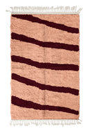 Open Stride zebra stripe wool rug, oxblood red stripes on blush pink, full view from above with fringed ends