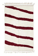 Open Stride zebra stripe wool rug, burgundy stripes on cream, full view from above with fringed ends