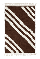 Cluster Stride zebra stripe wool rug, cream stripes on dark espresso brown, full view from above with fringed ends