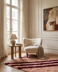 Load image into Gallery viewer, Burgundy and Blush Pink zebra stripe wool rug in a furnished room
