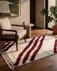 Load image into Gallery viewer, Burgundy and Cream zebra stripe wool rug in a furnished room
