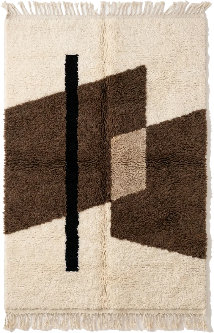 A Beni Ourain rug with ivory pile and dark line work