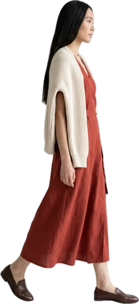 Woman walking in a long rust wrap dress