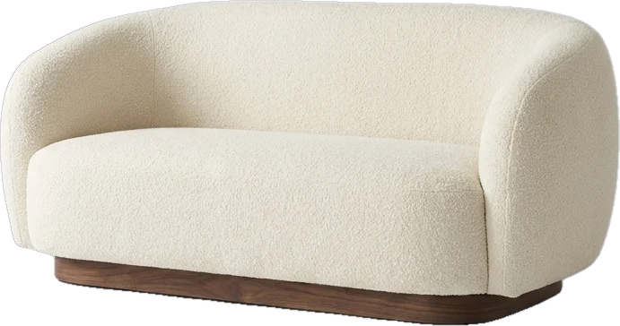 Cream boucle sofa on a walnut plinth