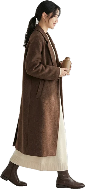 Woman walking in a long chocolate wool coat